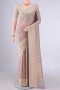 Pure Silk Mauve Banarasi Saree with Zari Butta on the body and Zari Border.  displayed on a mannequin