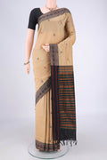 Dark Beige Blended Poly Cotton Saree with Thread Butta on the body and Thread Border.  displayed on a mannequin