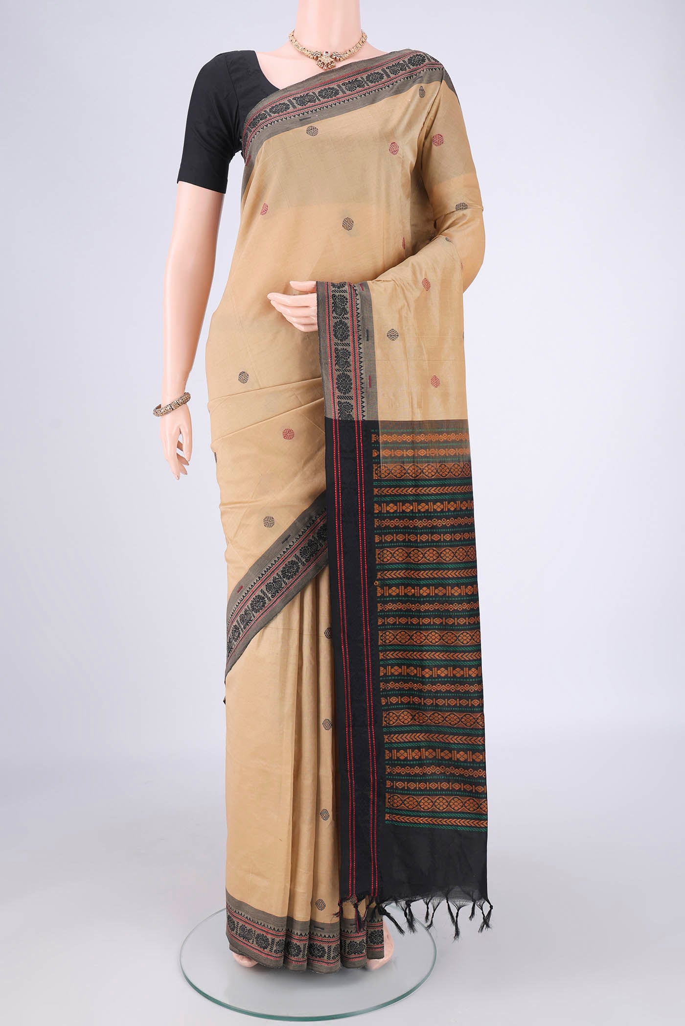 Dark Beige Blended Poly Cotton Saree with Thread Butta on the body and Thread Border.  displayed on a mannequin
