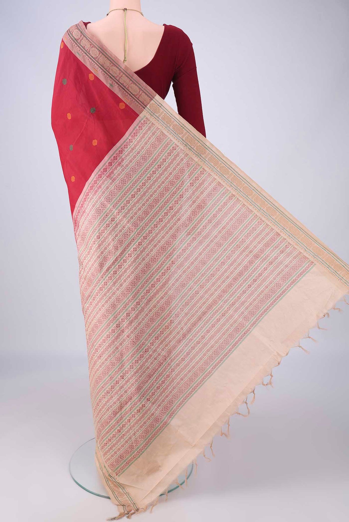 Flat view of Red Blended Poly Cotton Saree with Thread Butta on the body and Thread Border. 