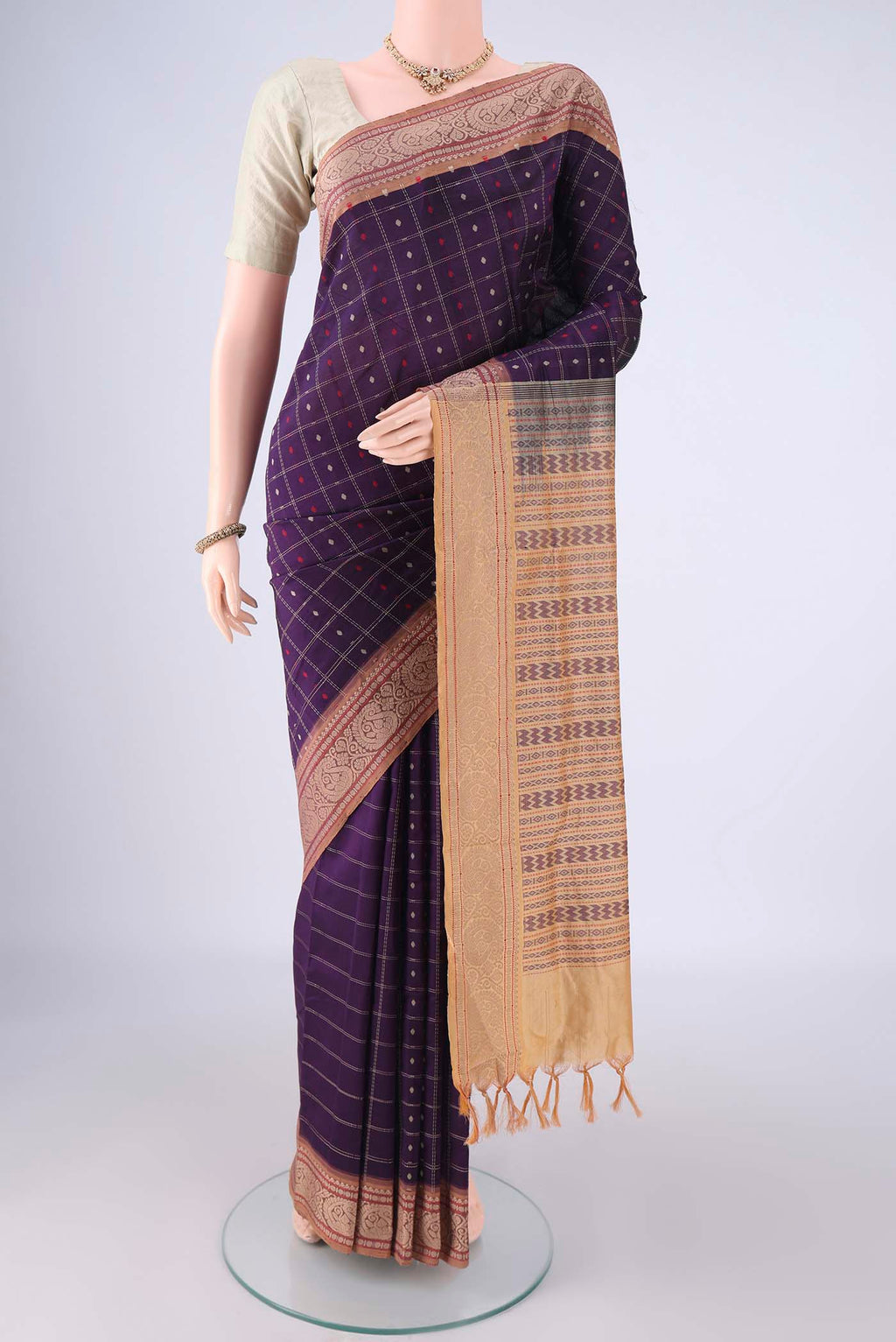 Purple Blended Poly Cotton Saree with Checked design on the body and Thread Border.  displayed on a mannequin