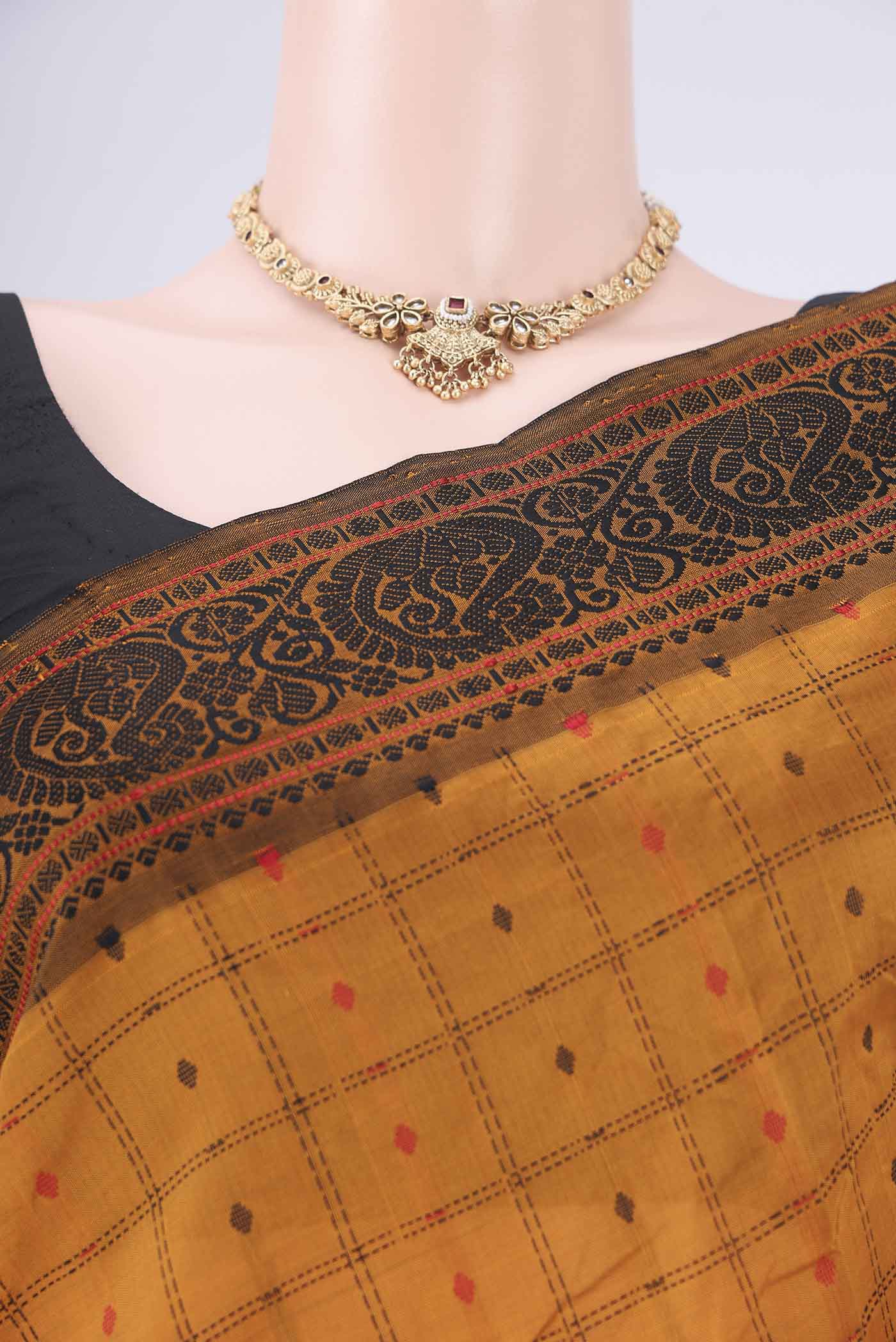 Border image of Mustard Blended Poly Cotton Saree with Checked design on the body and Thread Border. 