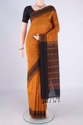 Mustard Blended Poly Cotton Saree with Checked design on the body and Thread Border.  displayed on a mannequin