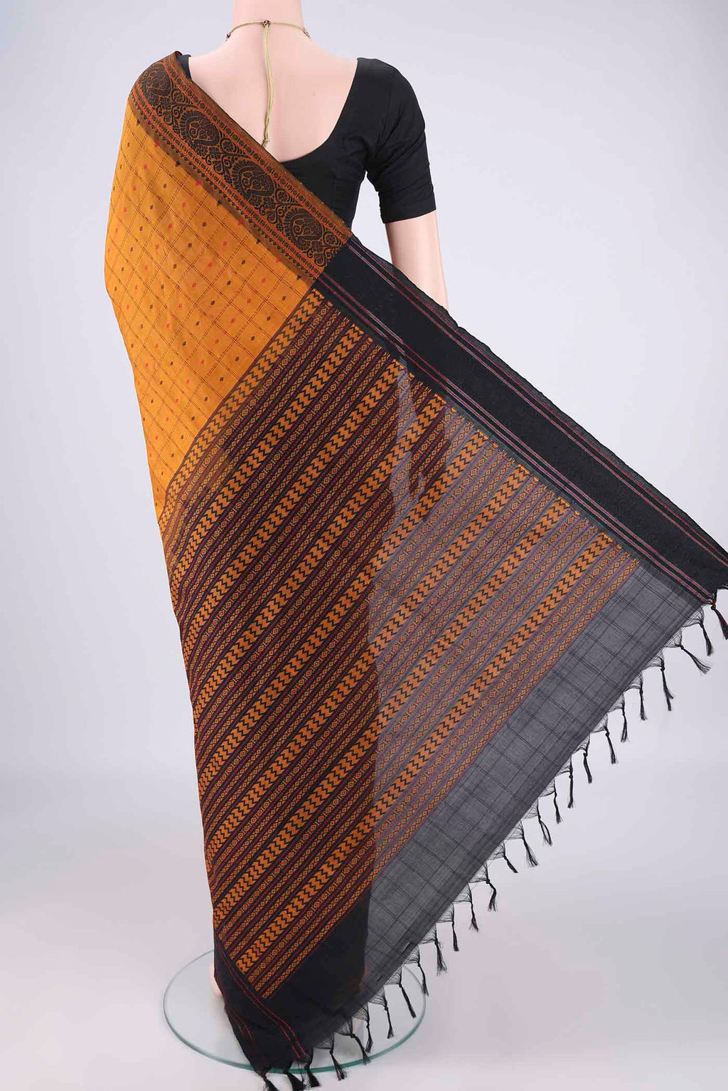 Flat view of Mustard Blended Poly Cotton Saree with Checked design on the body and Thread Border. 