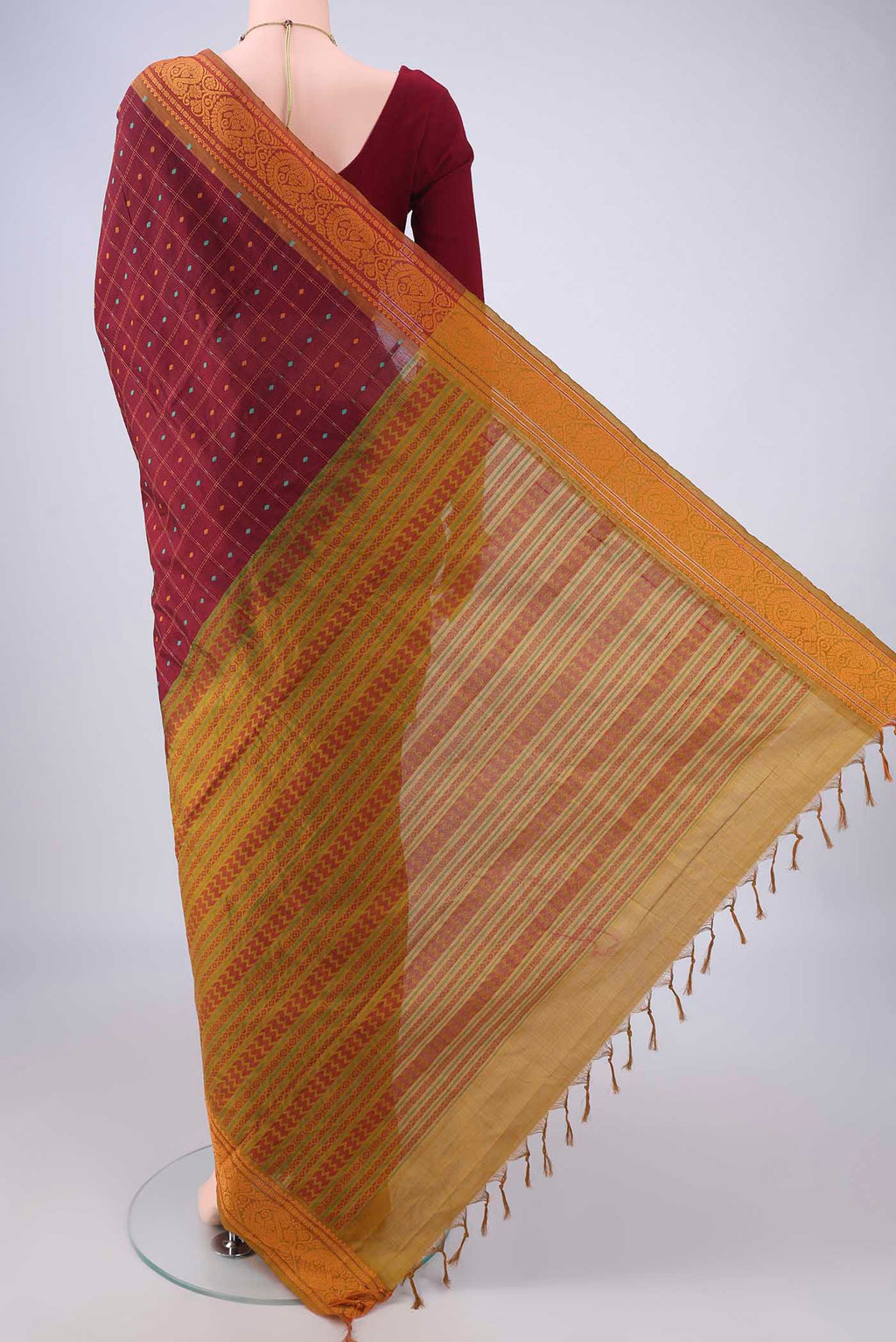 Flat view of Maroon Blended Poly Cotton Saree with Checked design on the body and Thread Border. 