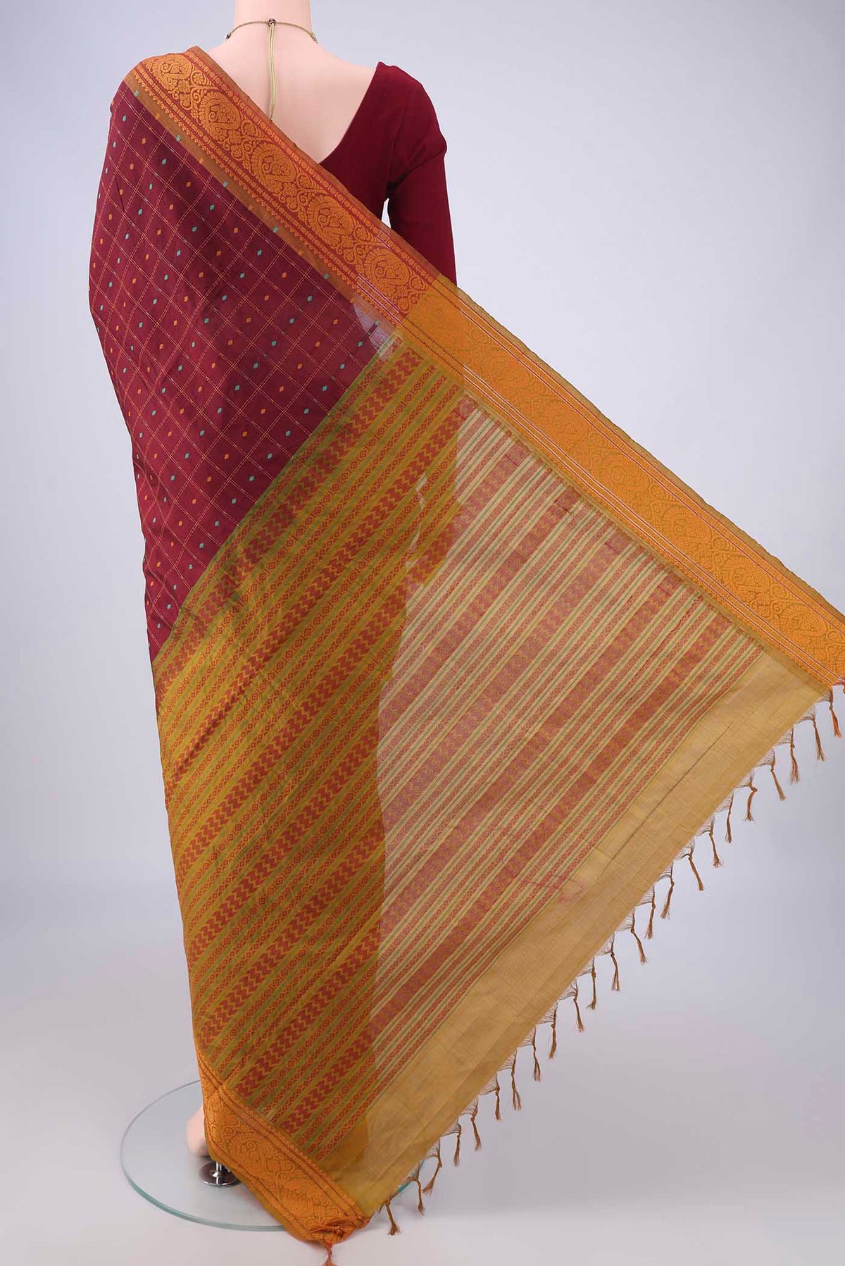 Flat view of Maroon Blended Poly Cotton Saree with Checked design on the body and Thread Border. 