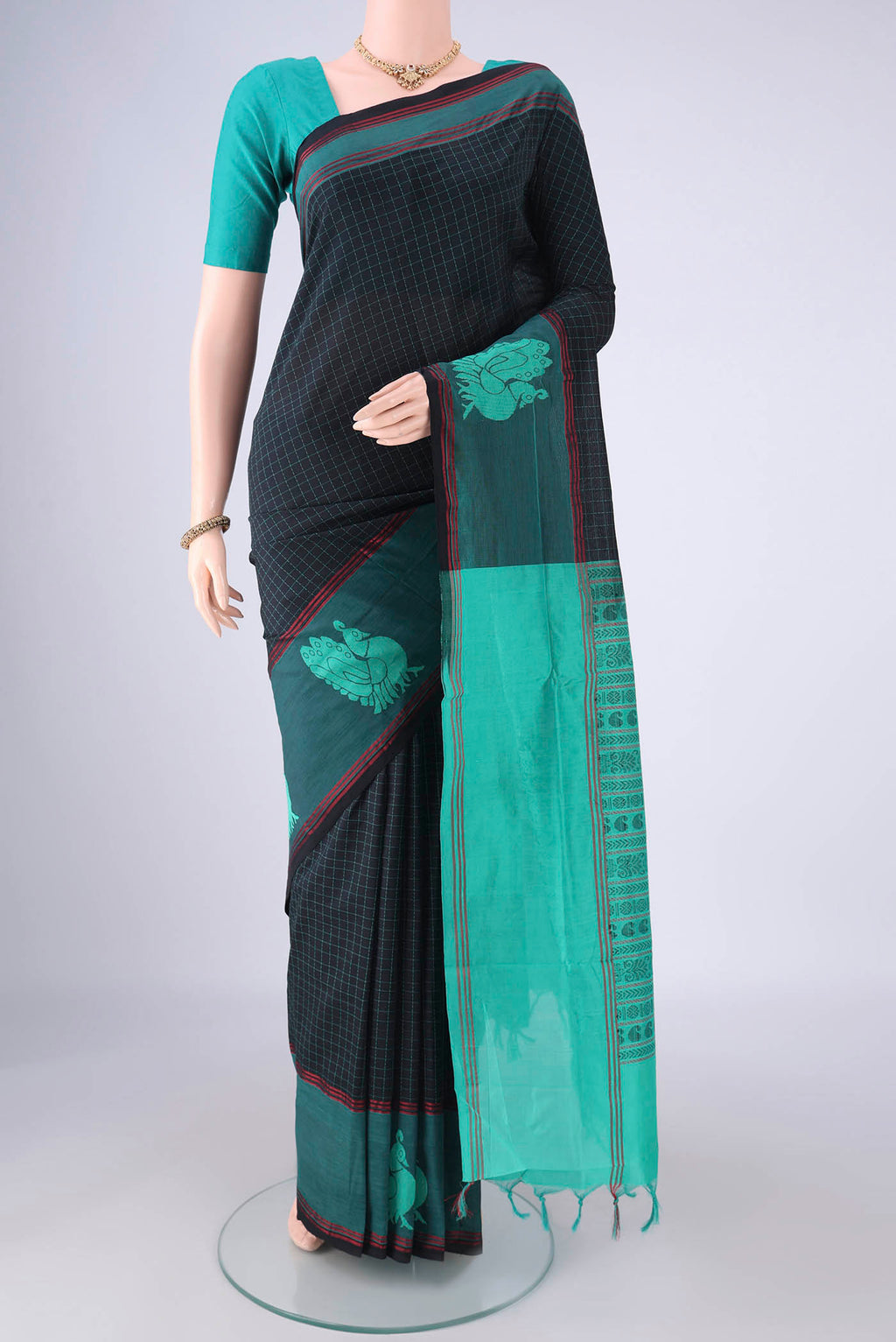 Black Blended Poly Cotton Saree with Checked design on the body and Thread Border.  displayed on a mannequin