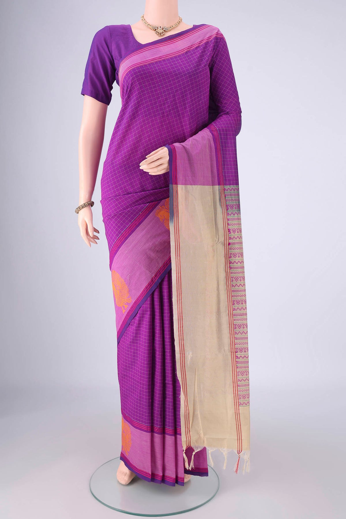 Purple Blended Poly Cotton Saree with Checked design on the body and Plain Border.  displayed on a mannequin