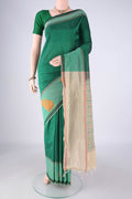 Green Blended Poly Cotton Saree with Checked design on the body and Plain Border.  displayed on a mannequin