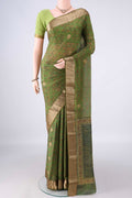 Green Mysore Crepe Saree with Printed design on the body and Zari Border.  displayed on a mannequin