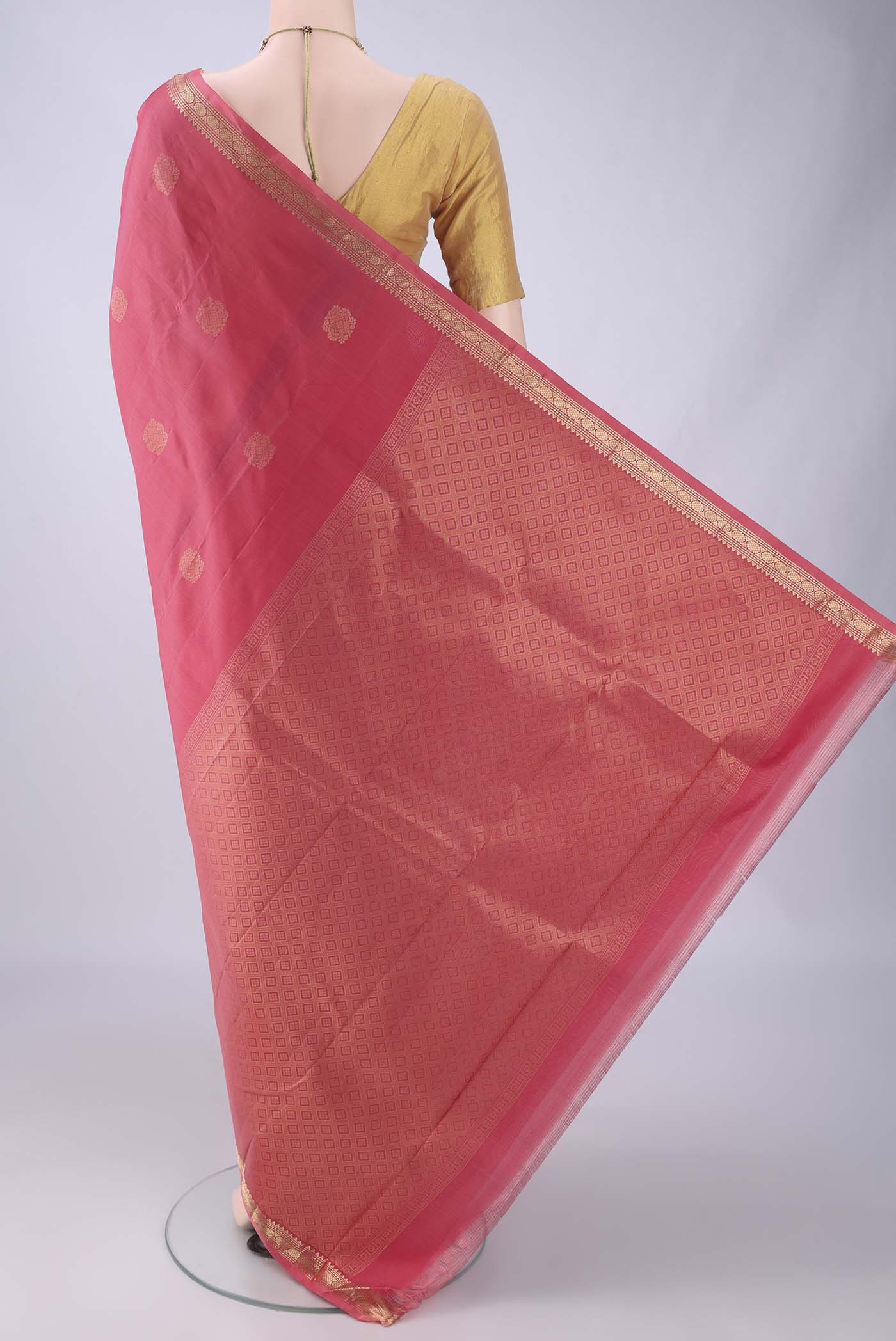 Flat view of Coral Dual Tone Kanjivaram Silk Saree with Zari Butta on the body and Zari Border. 