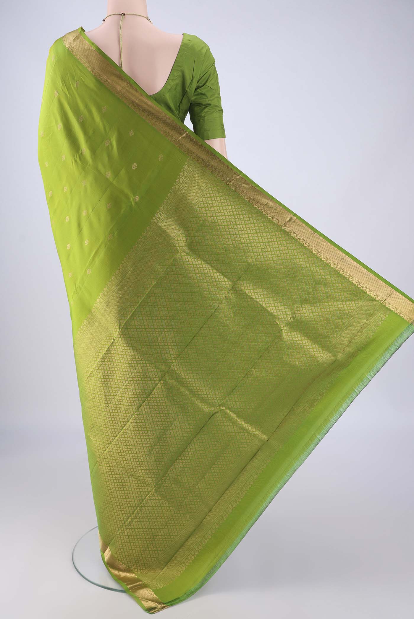 Flat view of Light Green Kanjivaram Silk Saree with Zari Butta on the body and Zari Border. 