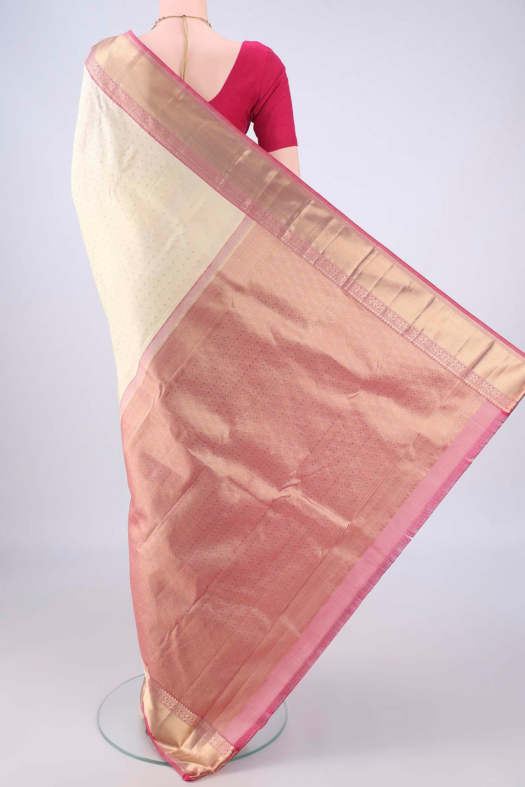 Flat view of Cream Kanchipuram Silk Saree with Zari Butta on the body and Zari Border. 