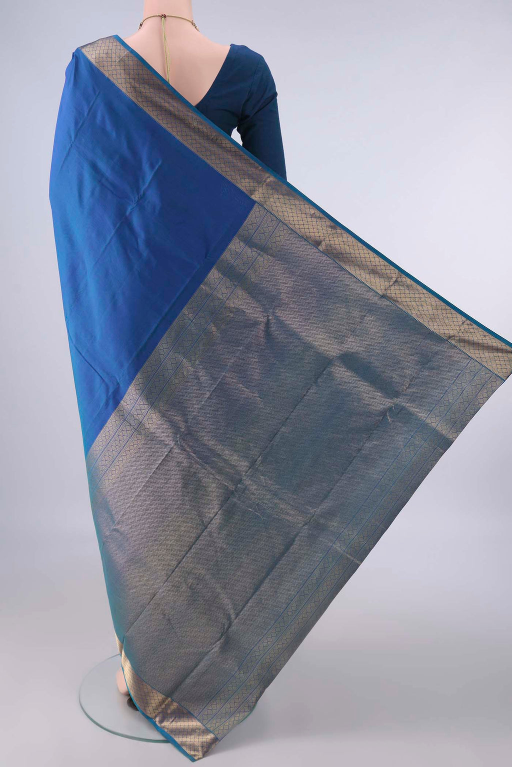 Flat view of Pure Silk Blue Dual Tone Kanchipuram Saree with Zari Butta on the body and Zari Border. 
