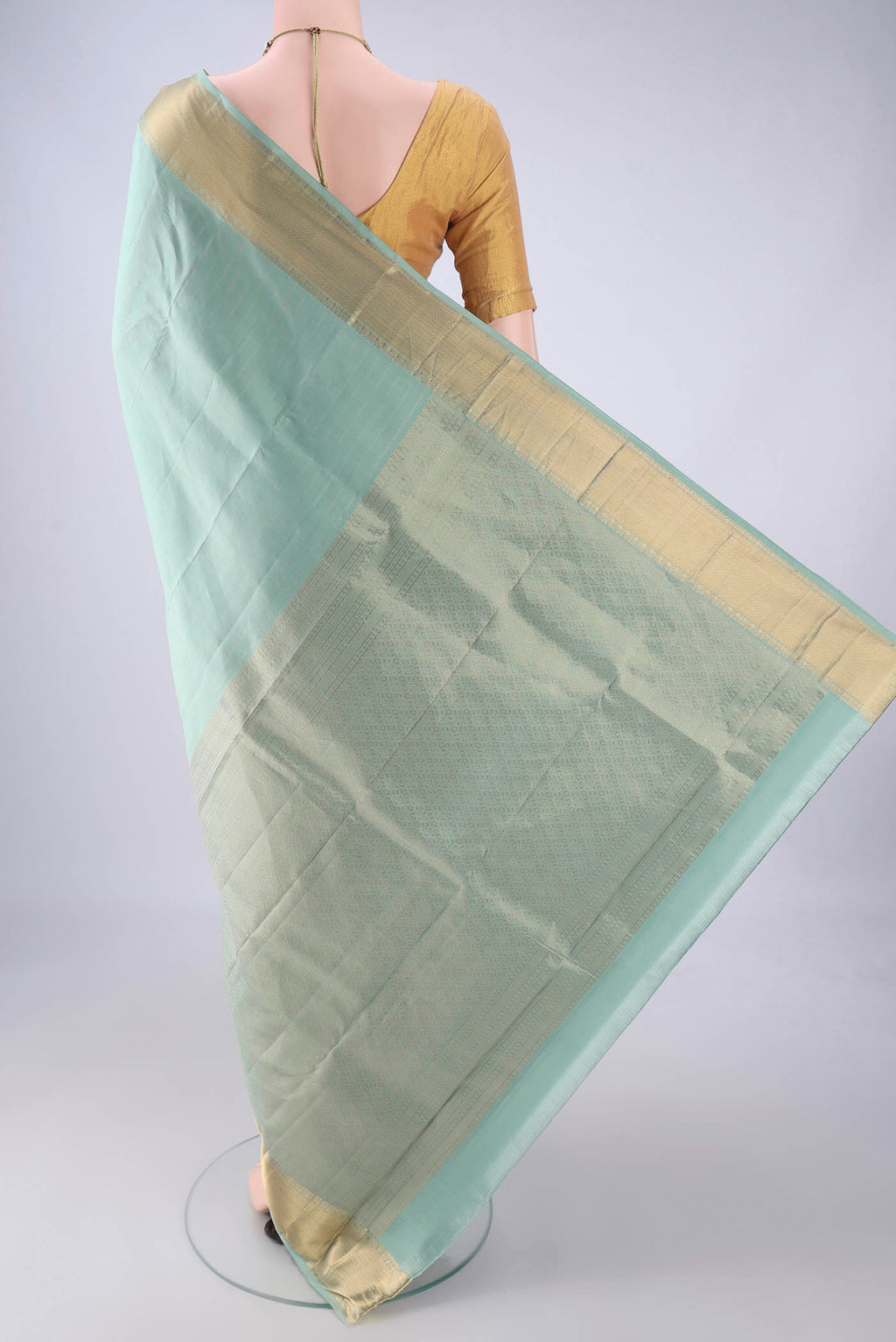 Flat view of Pista Green Kanchipuram Silk Saree with Stripes on the body and Zari Border. 