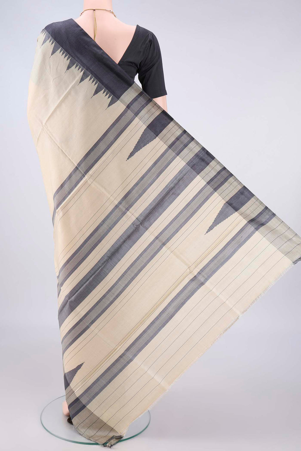 Flat view of Beige MP Tussar Saree with Plain Body and Temple Border. 