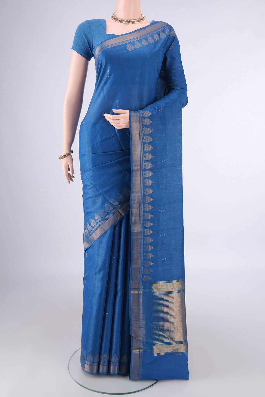 Blue MP Tussar Saree with Zari Butta on the body and Zari Border.  displayed on a mannequin