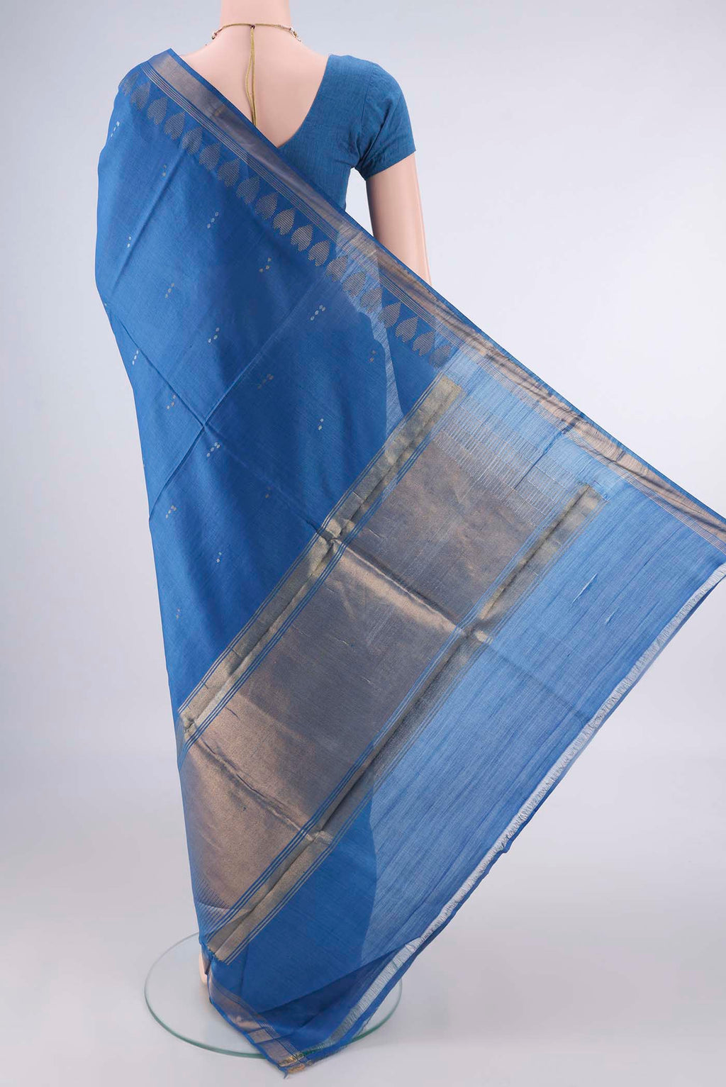 Flat view of Blue MP Tussar Saree with Zari Butta on the body and Zari Border. 