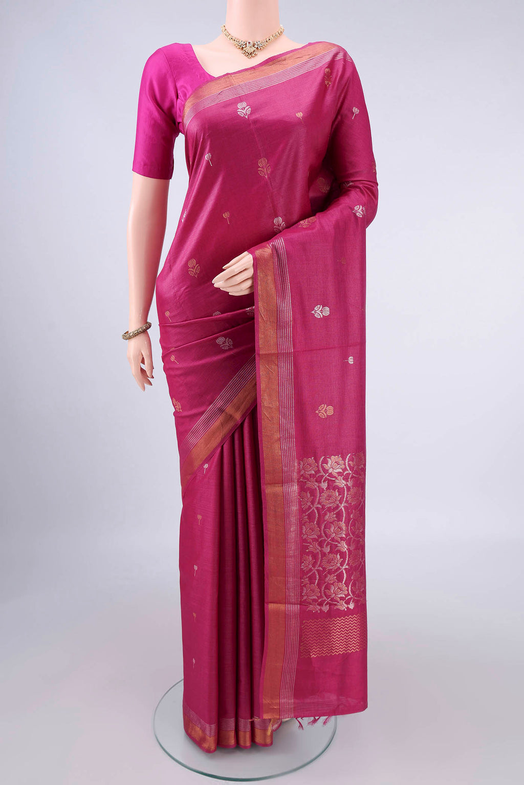 Dark Pink Tussar Saree with Zari Butta on the body and Zari Border.  displayed on a mannequin