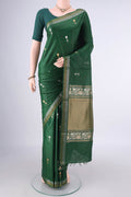 Bottle Green MP Tussar Saree with Zari Butta on the body and Zari Border.  displayed on a mannequin