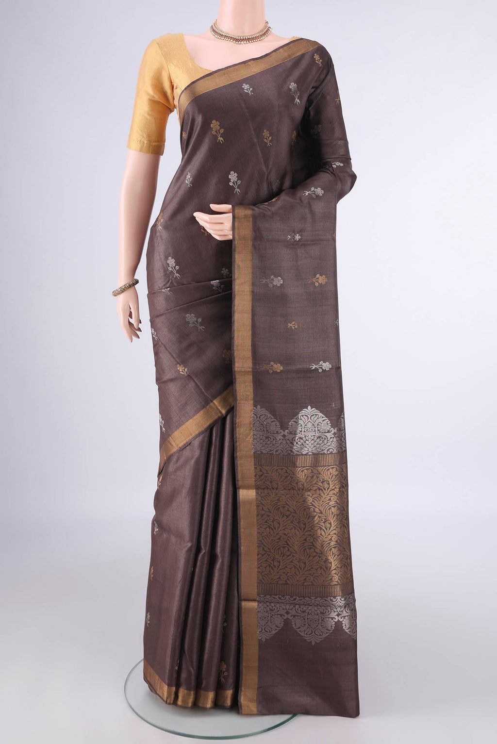 Coffee Brown MP Tussar Saree with Zari Butta on the body and Zari Border.  displayed on a mannequin