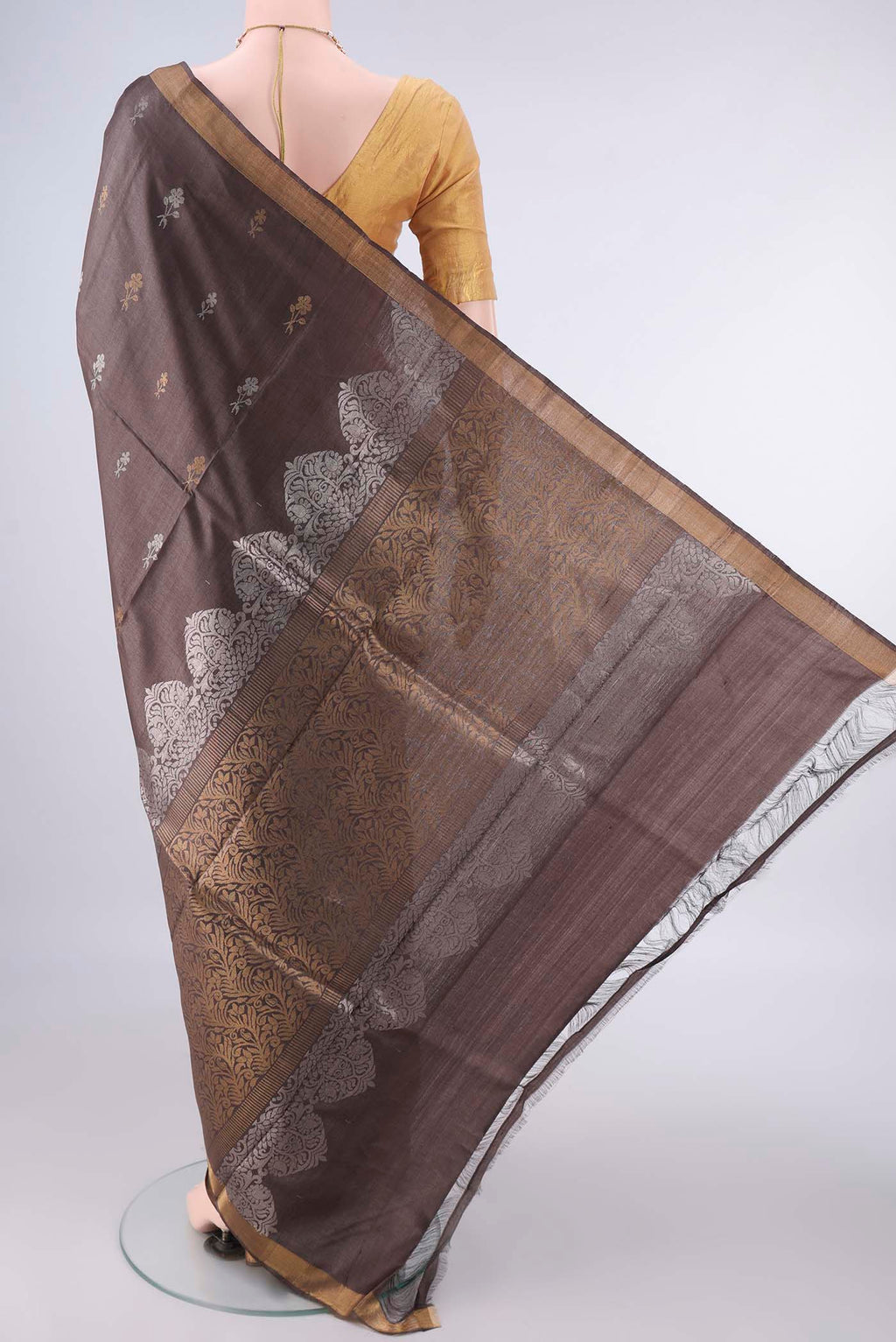 Flat view of Coffee Brown MP Tussar Saree with Zari Butta on the body and Zari Border. 
