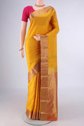 Pure Silk Mustard Kanjivaram Saree with Plain Body and Zari Border.  displayed on a mannequin