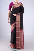 Black Kanchipuram Silk Saree with Checked design on the body and Zari Border.  displayed on a mannequin
