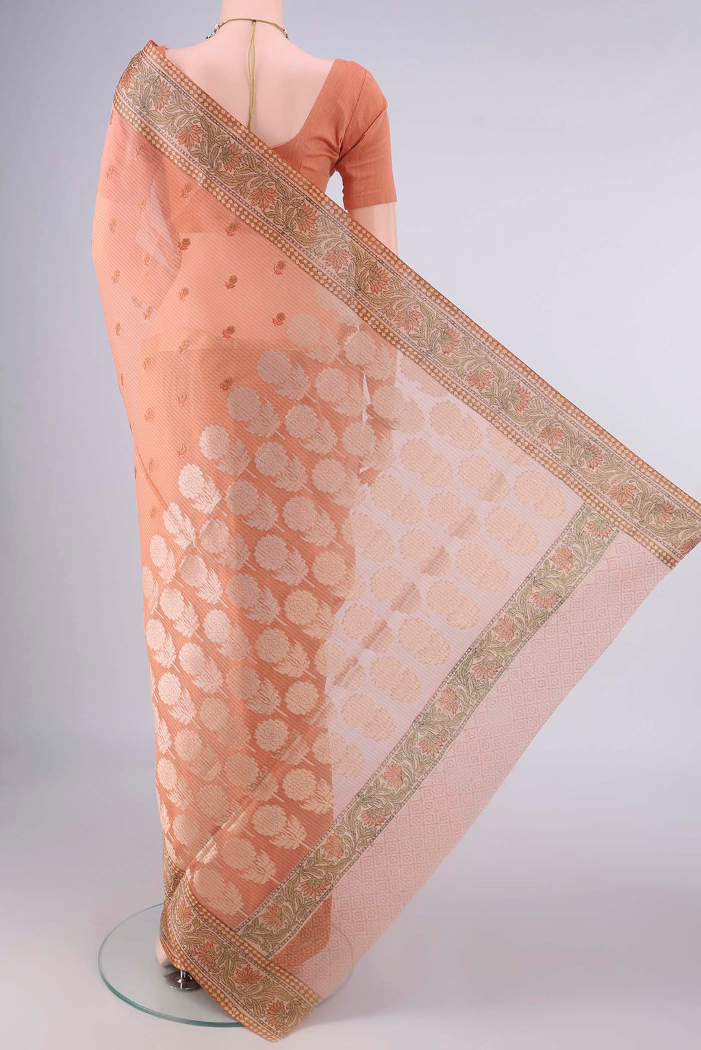 Flat view of Orange Blended Kota Cotton Saree with Embroidery on the body and Zari And Thread Border. 
