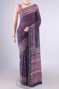 Blue Maheshwari Cotton Saree with Batik Print on the body and Zari Border.  displayed on a mannequin