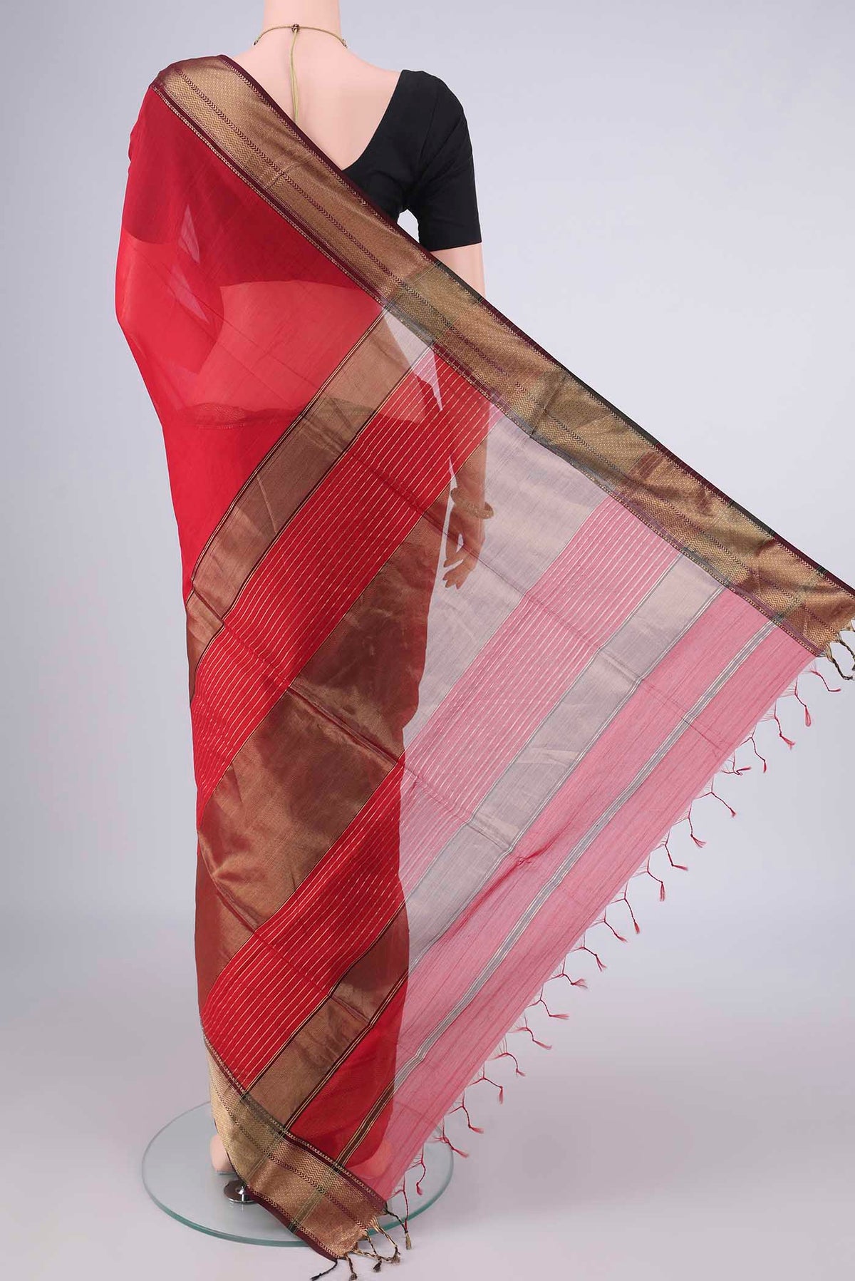 Flat view of Red Maheshwari Cotton Saree with Plain Body and Zari Border. 
