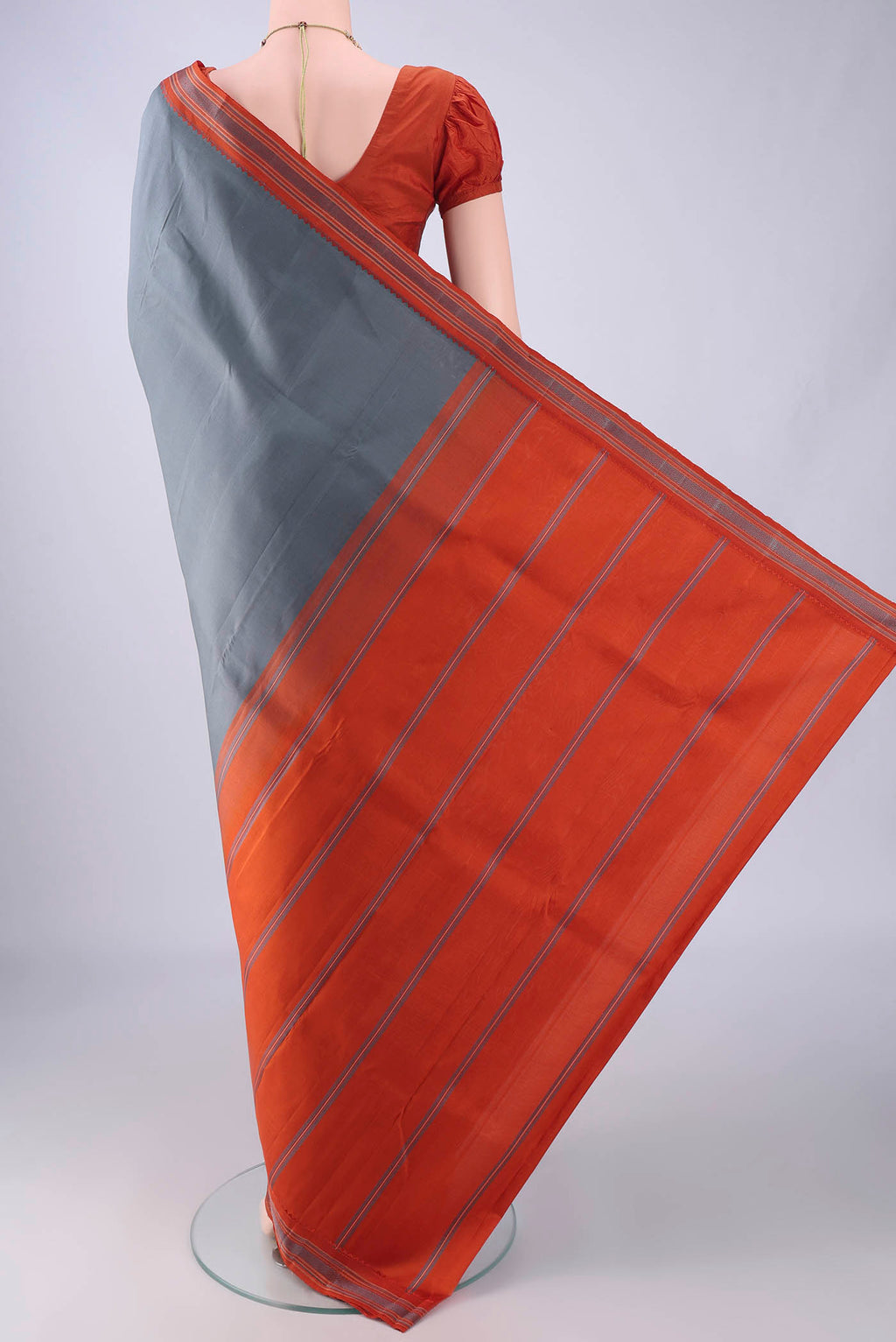Flat view of Davys Grey Kanjivaram Silk Saree with Plain Body and Thread Border. 