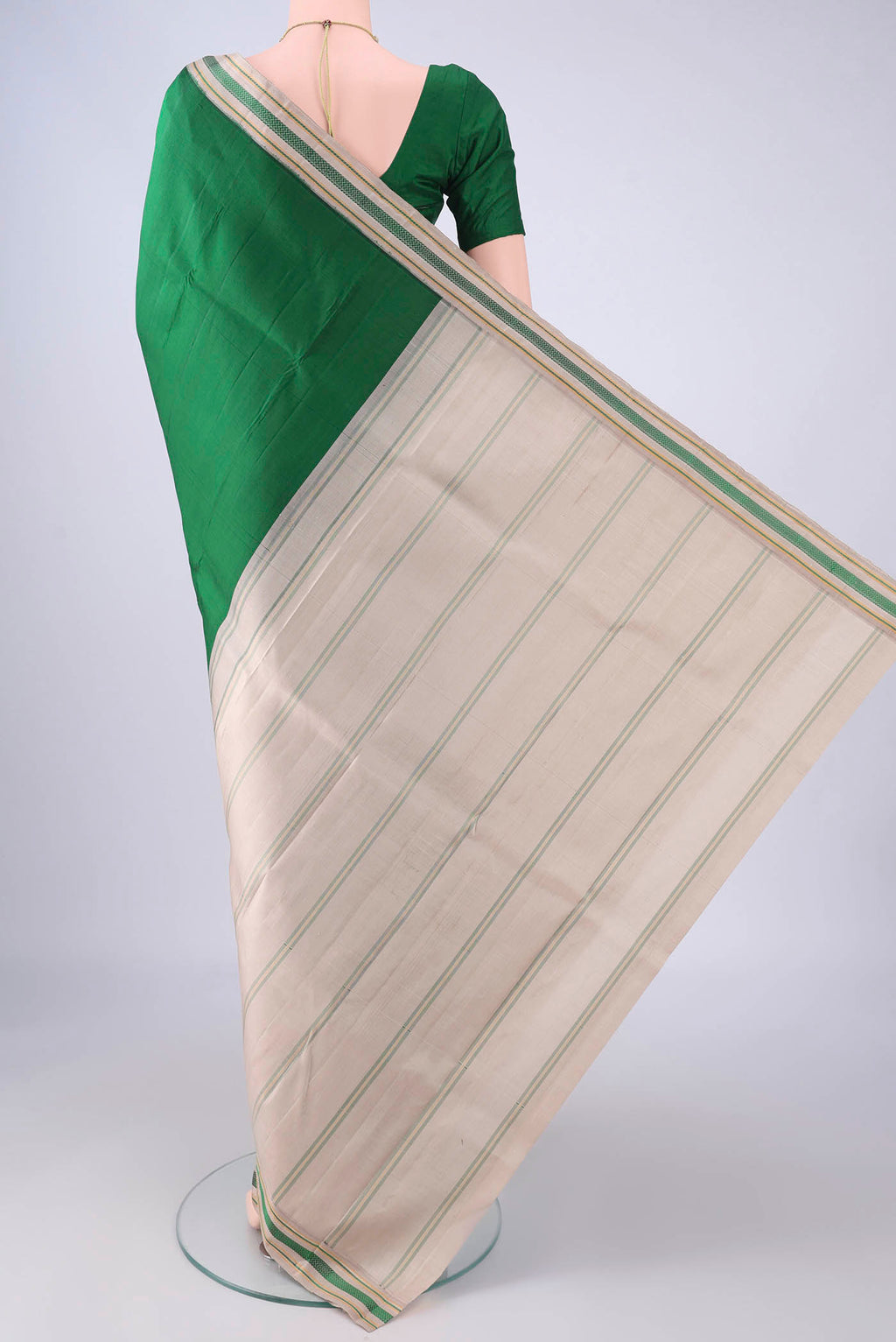 Flat view of Green Kanjivaram Silk Saree with Plain Body and Thread Border. 
