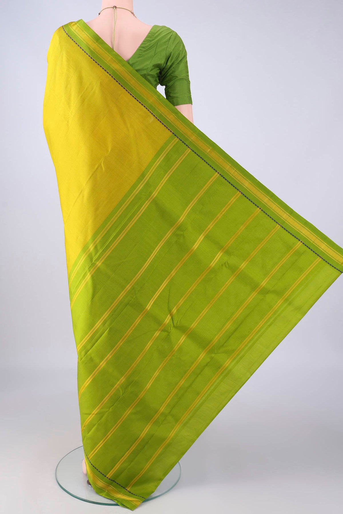 Flat view of Acid Green Kanjivaram Silk Saree with Plain Body and Thread Border. 