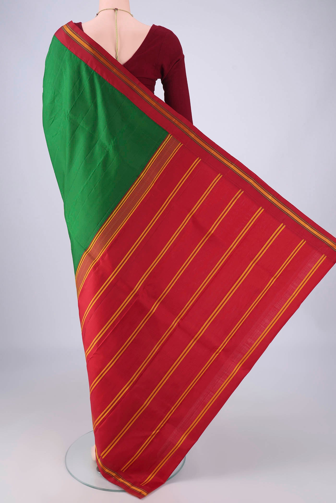 Flat view of Green Kanjivaram Silk Saree with Plain Body and Thread Border. 