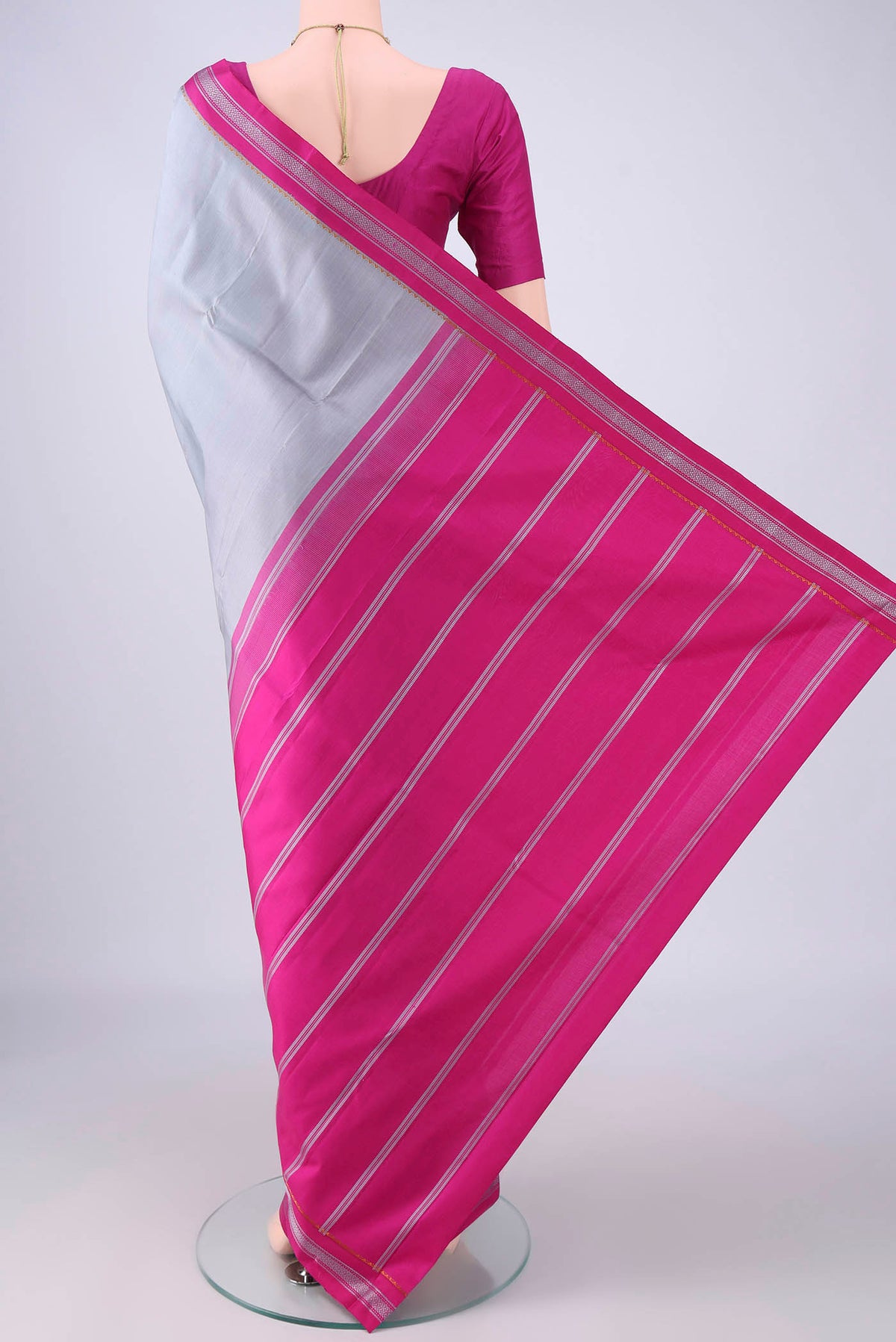 Flat view of Grey Kanjivaram Silk Saree with Plain Body and Thread Border. 