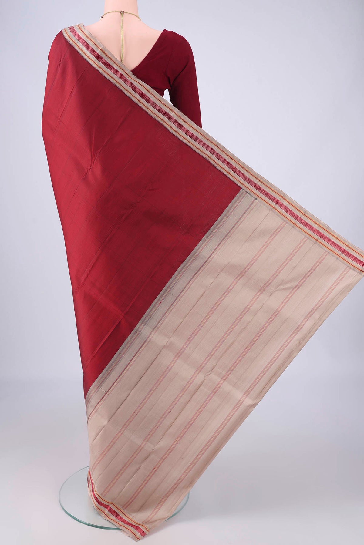 Flat view of Maroon Kanjivaram Silk Saree with Plain Body and Thread Border. 