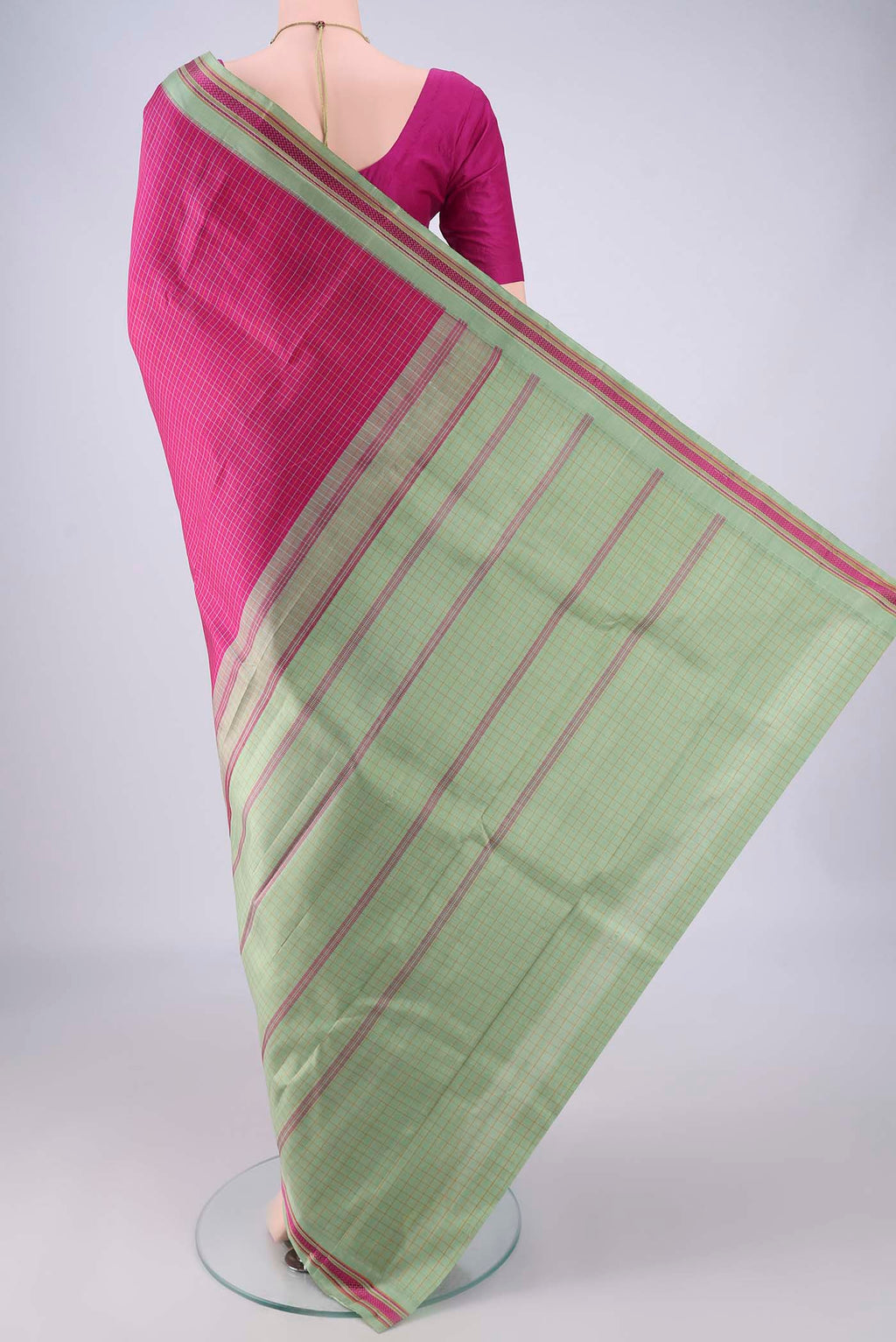 Flat view of Rani Pink Kanjivaram Silk Saree with Checked design on the body and Thread Border. 