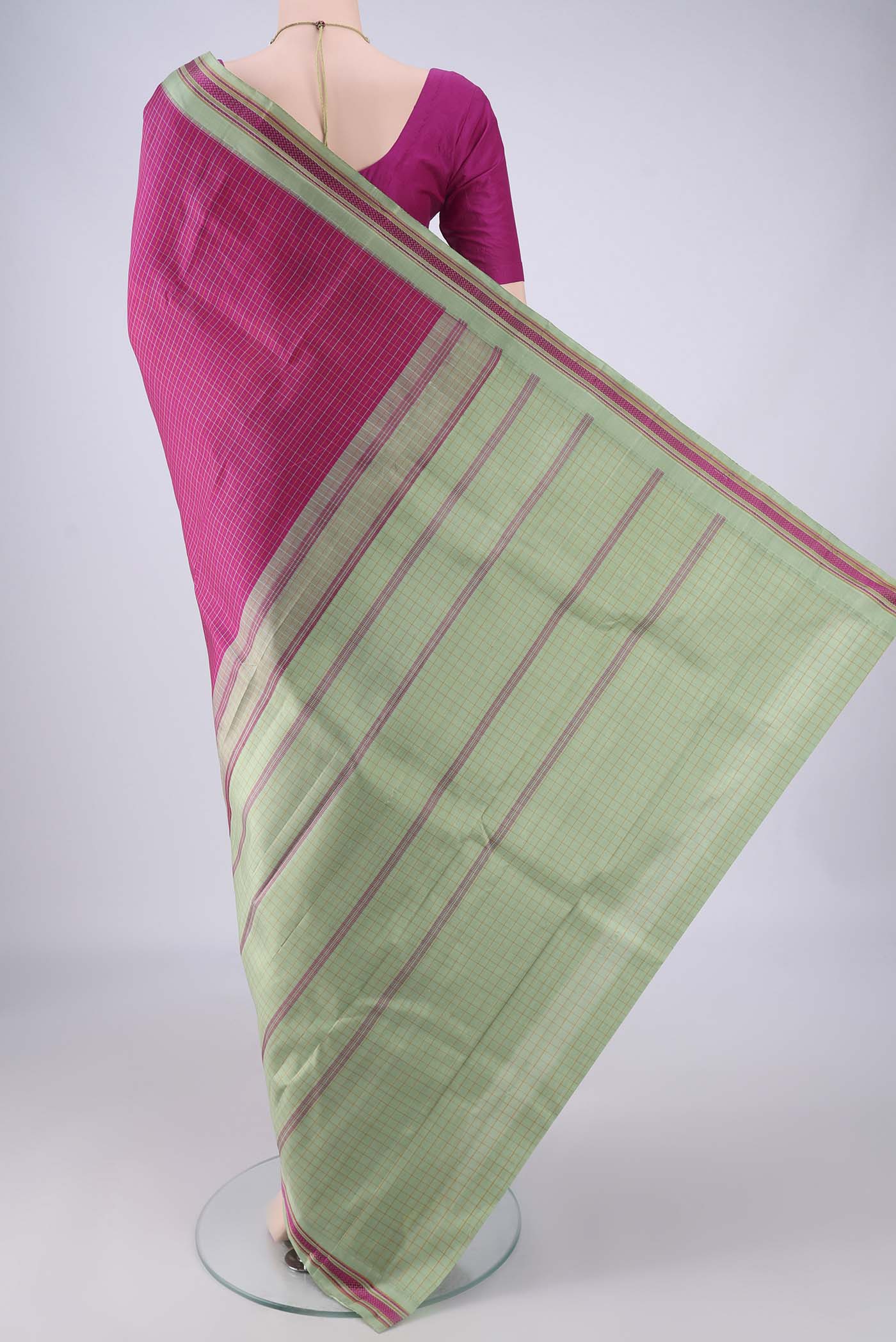 Flat view of Rani Pink Kanjivaram Silk Saree with Checked design on the body and Thread Border. 