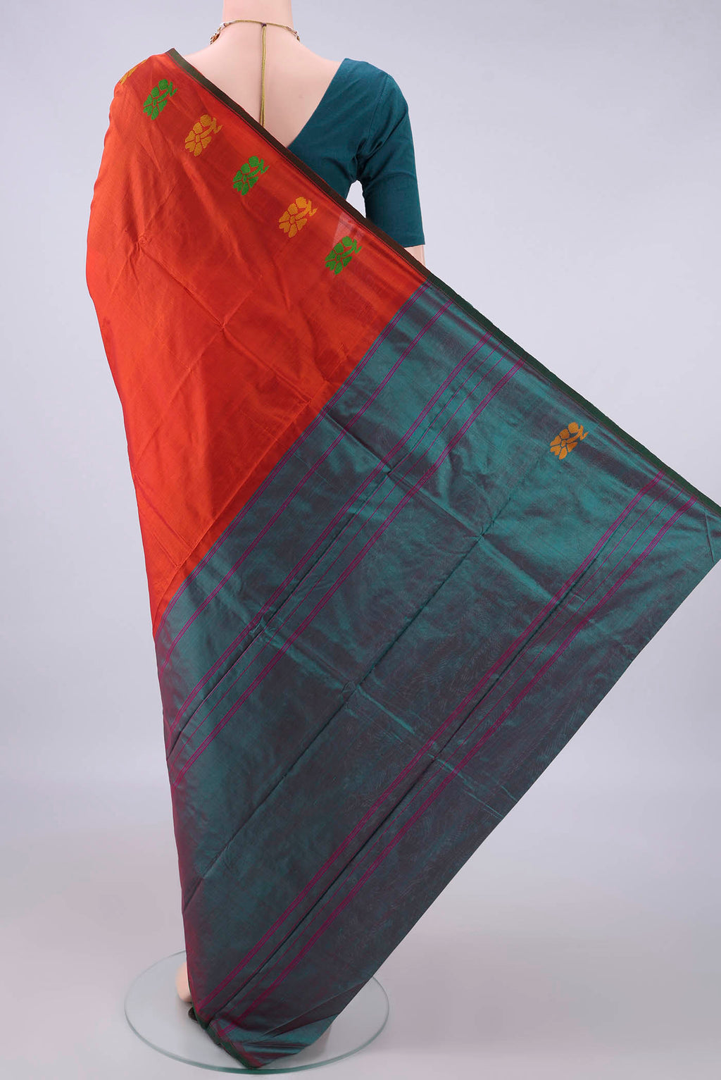 Flat view of Pure Silk Orange Kanchipuram Saree with Plain Body and Thread Border. 