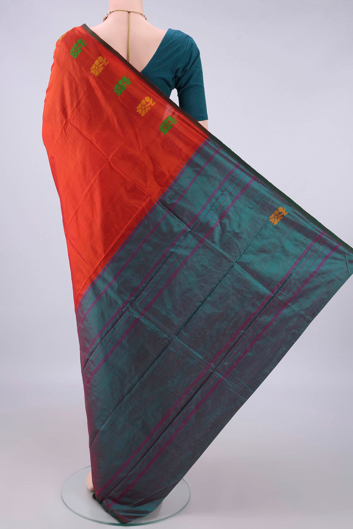 Flat view of Pure Silk Orange Kanchipuram Saree with Plain Body and Thread Border. 