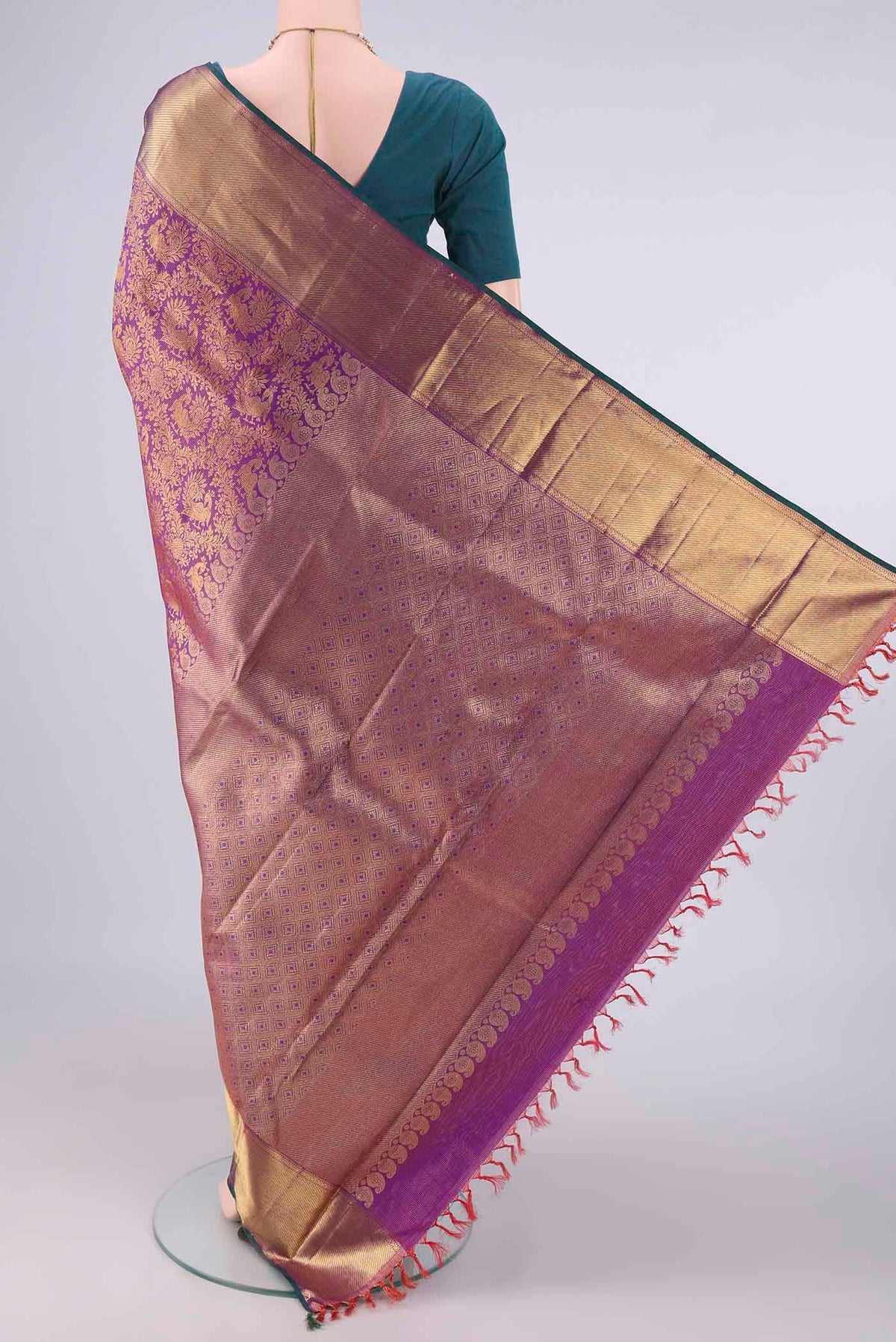 Flat view of Pure Silk Pure Zari Purple Kanjivaram Saree with Zari Brocade on the body and Zari Border. 