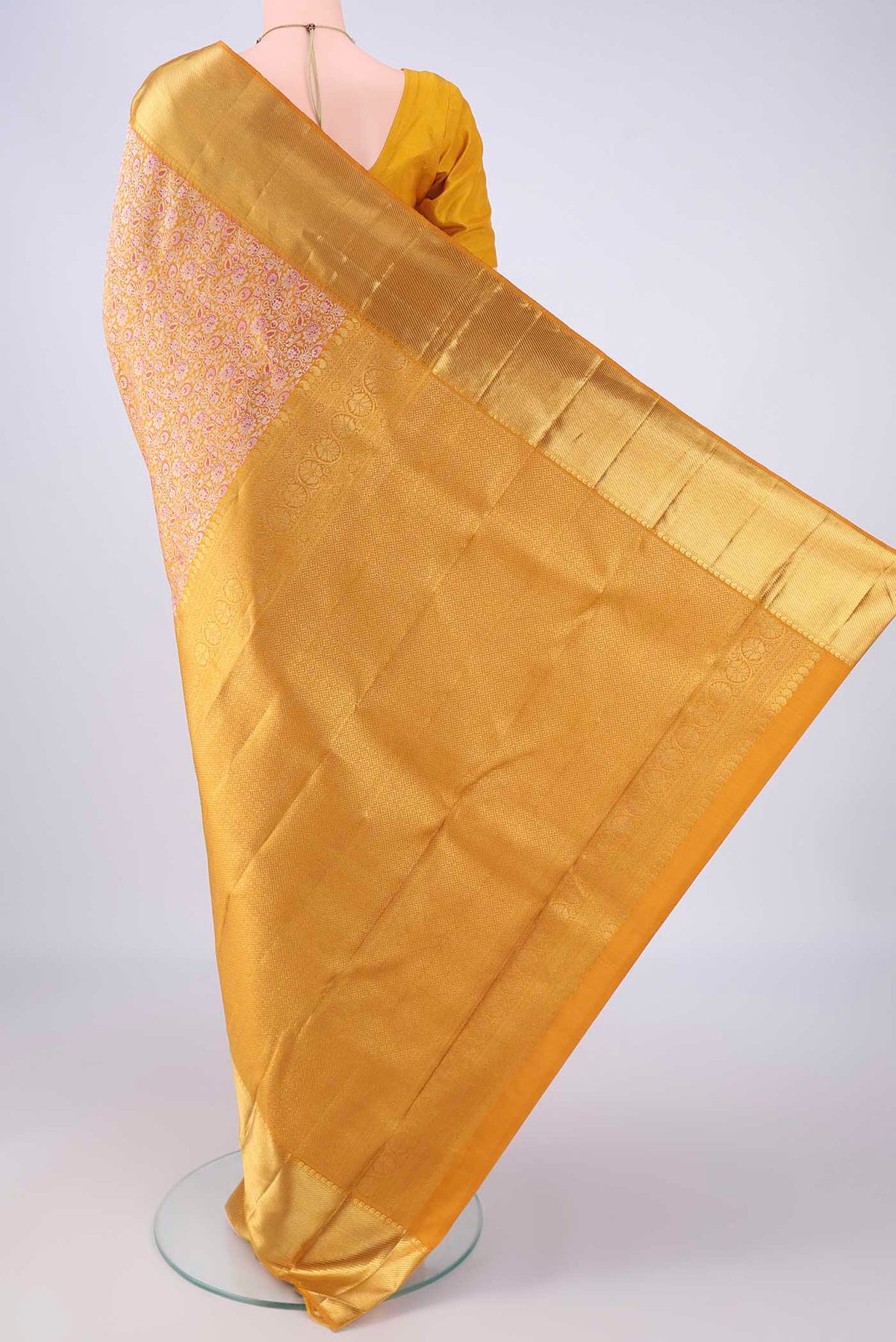 Flat view of Pure Silk Pure Zari Mustard Kanjivaram Saree with Zari Brocade on the body and Zari Border. 