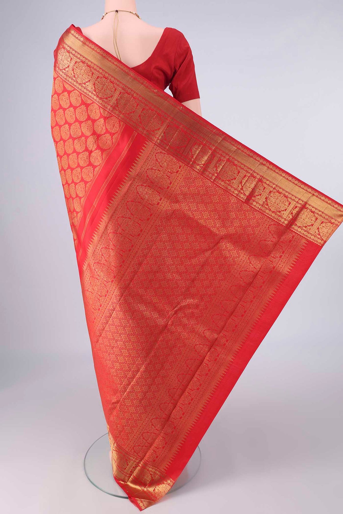 Flat view of Pure Silk Pure Zari Red Kanjivaram Saree with Zari Brocade on the body and Zari Border. 