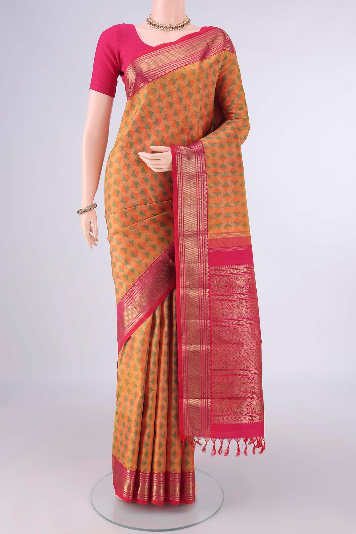 Pure Silk Multi Color Kanjivaram Saree with Jacquard design on the body and Zari Border.  displayed on a mannequin