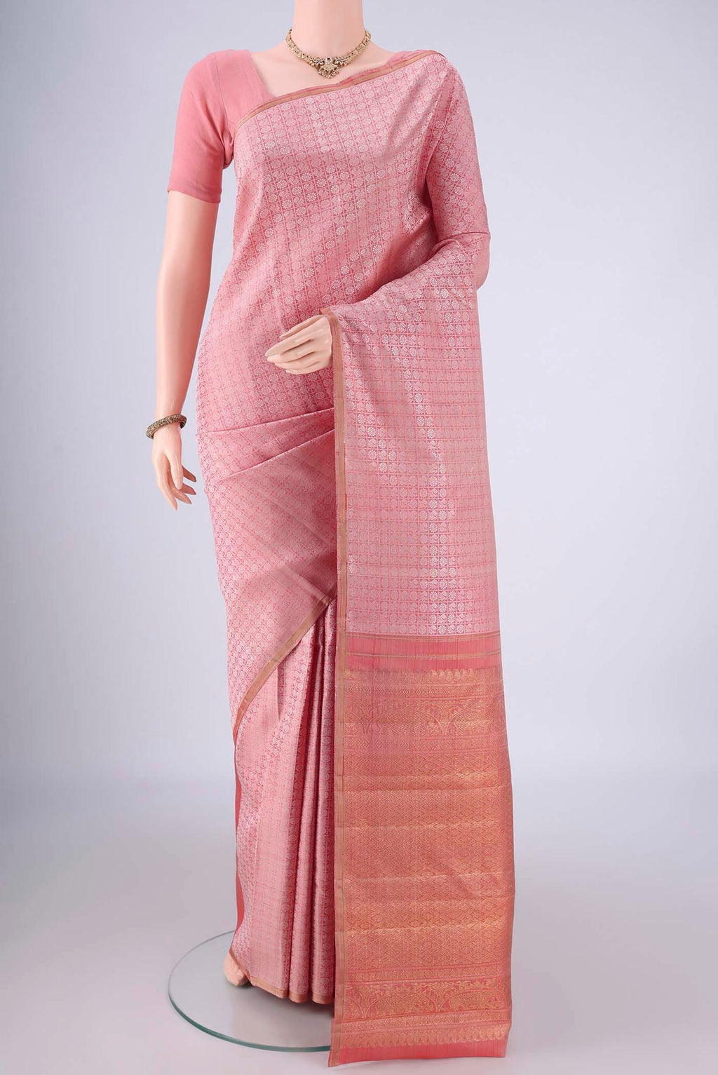 Rose Gold Kanchipuram Silk Saree with Jacquard design on the body and Without Border.  displayed on a mannequin