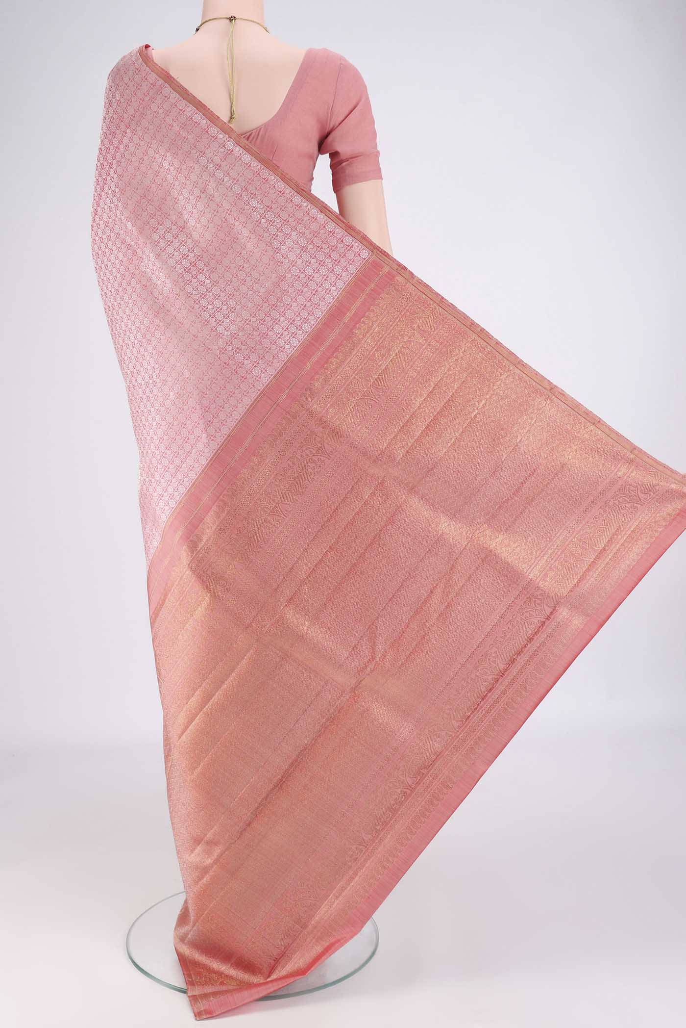 Flat view of Rose Gold Kanchipuram Silk Saree with Jacquard design on the body and Without Border. 