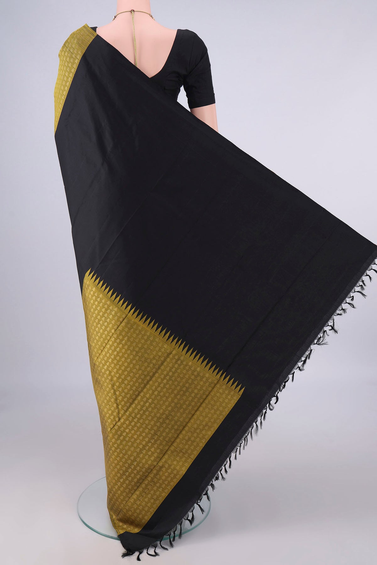 Flat view of Pure Silk Black Kanchipuram Saree with Partli on the body and Without Border. 
