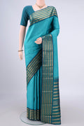 Pure Silk Pure Zari Turquoise Kanjivaram Saree with Zari Butta on the body and Zari Border.  displayed on a mannequin