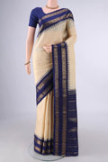 Pure Silk Pure Zari Sandal Kanchipuram Saree with Plain Body and Temple Border.  displayed on a mannequin